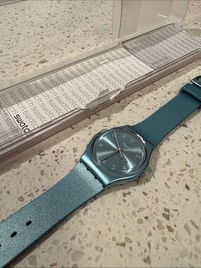 Water resistant Swatch Metallic Teal Analog Watch